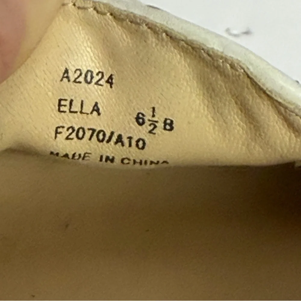 Coach Ella loafers in a gold and white signature monogram canvas. Size 6.5